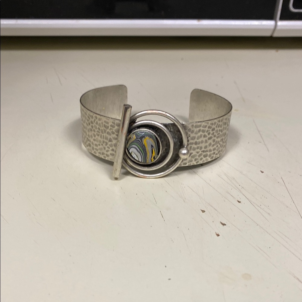 Silver Textured Bracelet with Artistic Centerpiece
